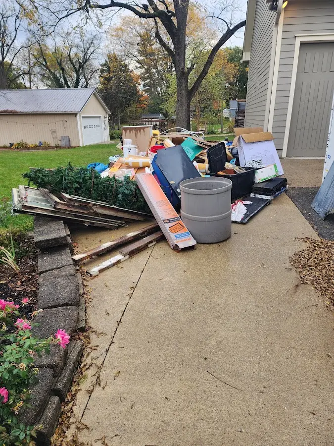 Dumpster being loaded with debris for Residential Dumpster Rental in La Crescenta-Montrose